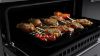Rangemaster 15834 Edge Deluxe 110cm Induction Range Cooker in Black Glass with Chrome Trim - EDDLB110EIGBLK/CM1_oven