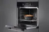 Miele H 2465 BP 59.5cm Built In Electric Single Oven - Black & Stainless Steel_in use